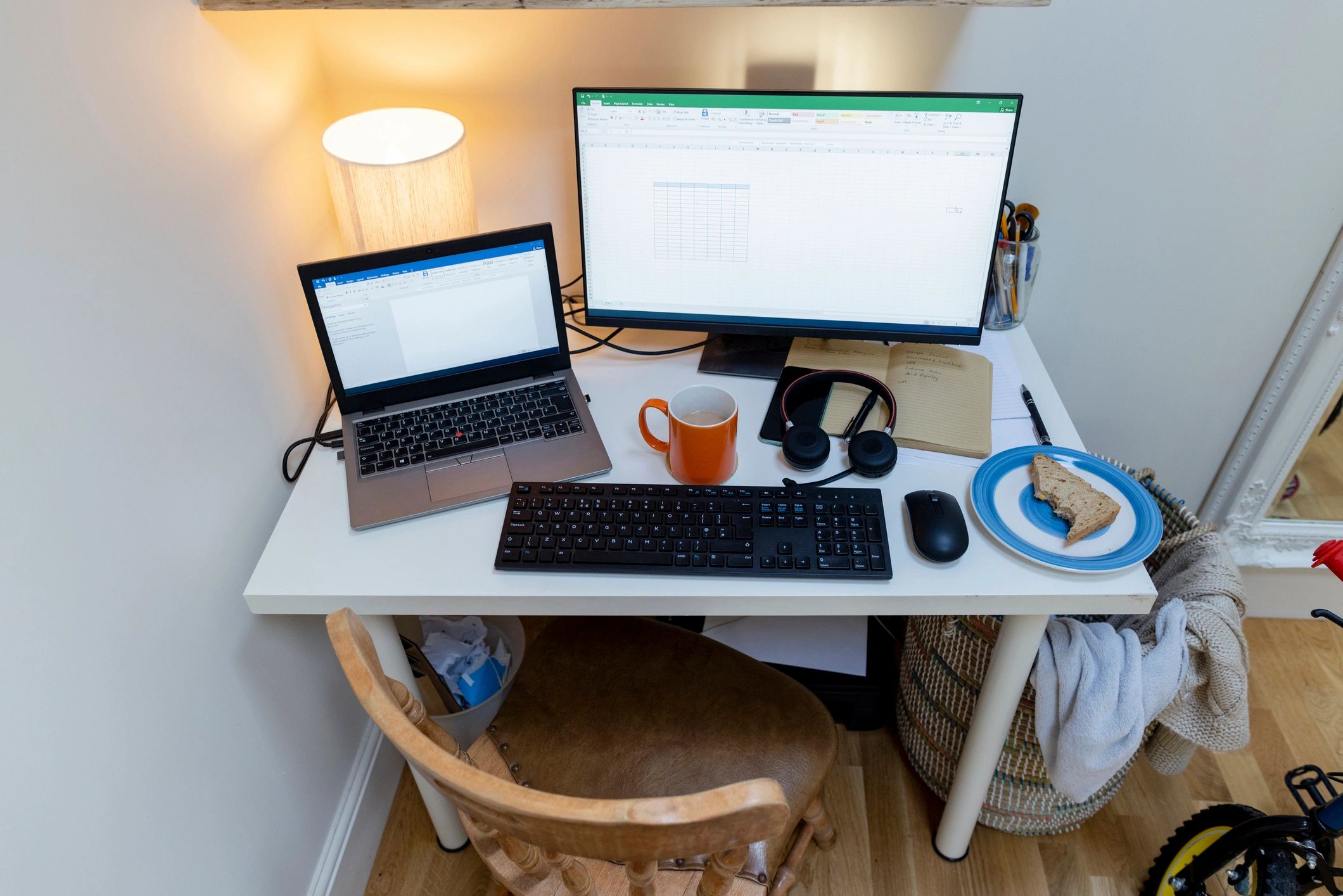 Modern home office desk setup with dual monitors